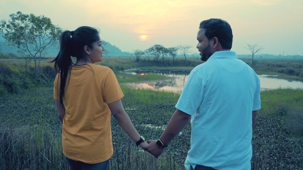 Adhorua film still: a couple at sunset