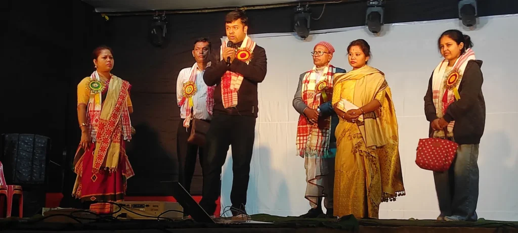 Felicitation on stage at a cultural event in Assam