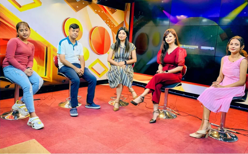 Actors and filmmakers in a television studio interview